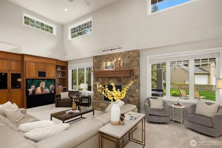 Family Room with stone Fireplace and 2 story ceiling~