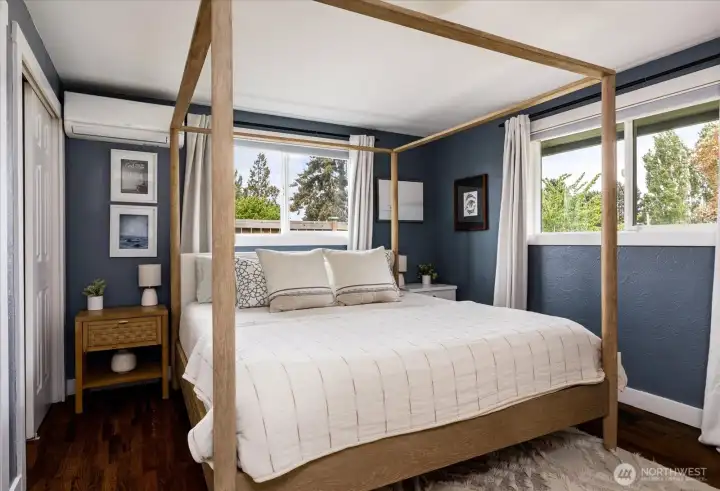 Primary bedroom easily accommodates an oversized king bed frame.