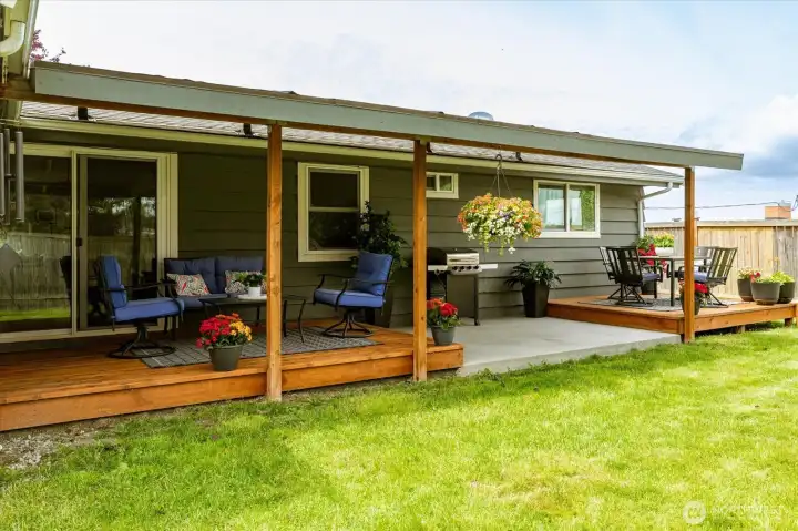 Spacious covered deck and patio make it convenient for all year round enjoyment