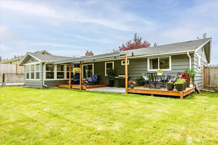 Large backyard with options to add multiple raised beds or set up games for family and friends