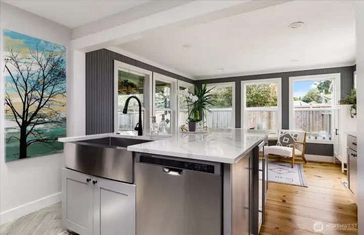 Large farmhouse sink and well situated dishwasher