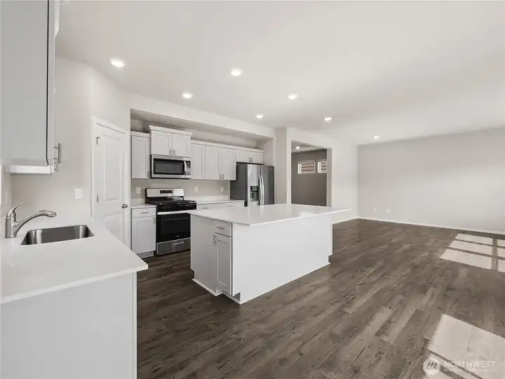 Easy access to dining room and great room from kitchen. Finishes and options will vary.