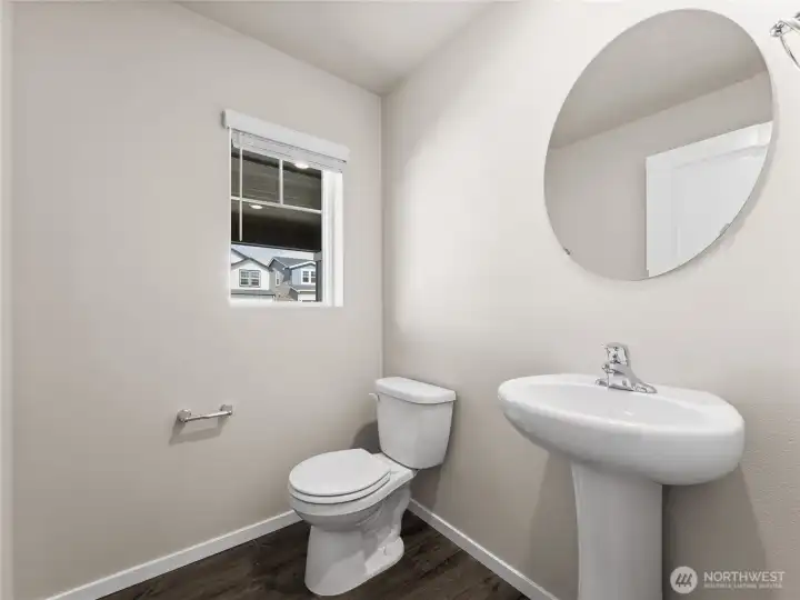 Powder bathroom on main floor. Finishes and options will vary.