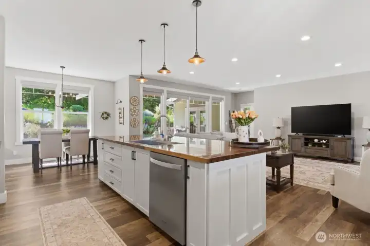 Stunning counters overlook the living area and large sliding doors to the rear covered deck area.