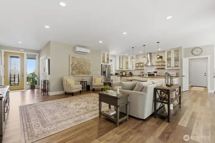 The thoughtfully laid-out open concept also creates usable zones of uses and living spaces.