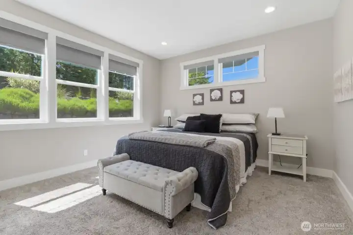 The primary bedroom has large south facing windows.