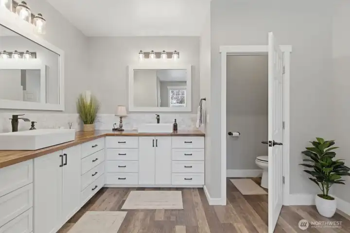 The large primary bathroom includes double vanities and plenty of counter space.