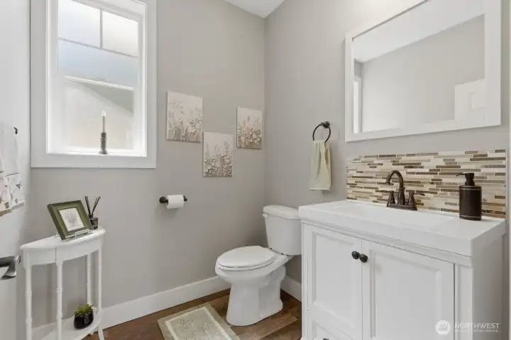 A half-bath across the hall from the laundry and conveniently located near kitchen and living areas.