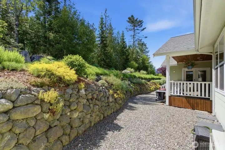Terraced rockery frames the low maintenance backyard.