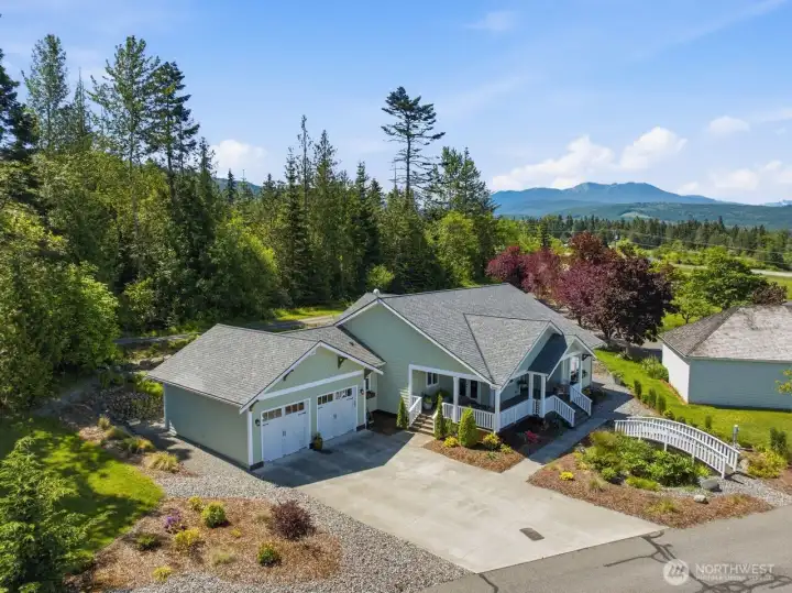 The Olympic Mountains serve as backdrop to this home.
