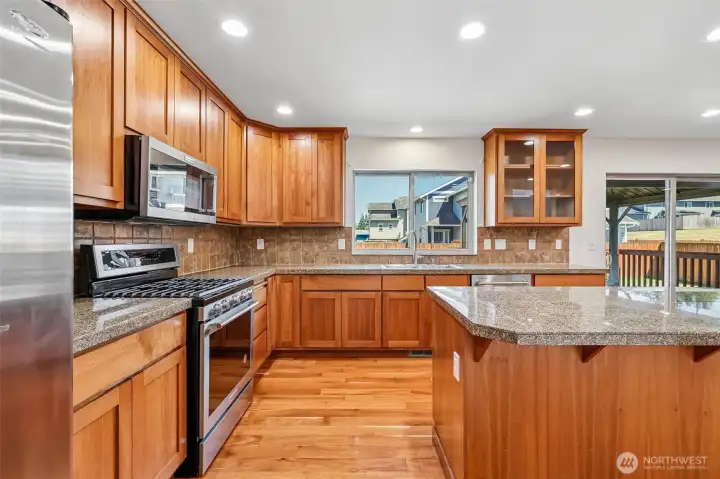 Kitchen with granite tile counters