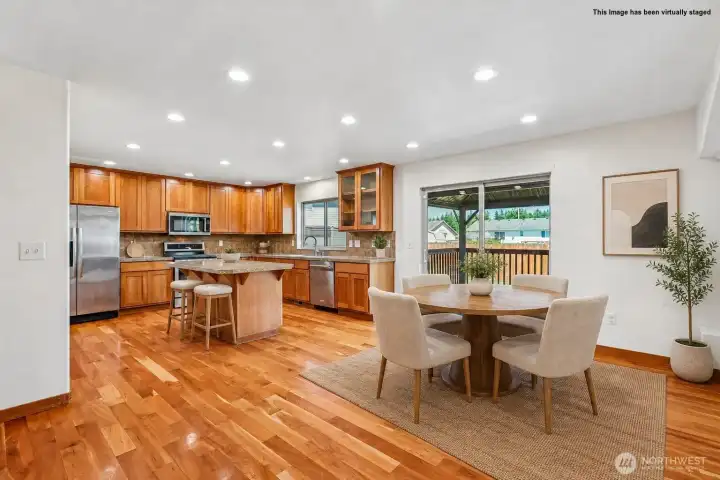 Kitchen and dining area with sliding door to back yard