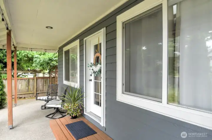 East access - just two steps into the home via this private and generous front porch. East access - just two steps into the home via this private and generous front porch.