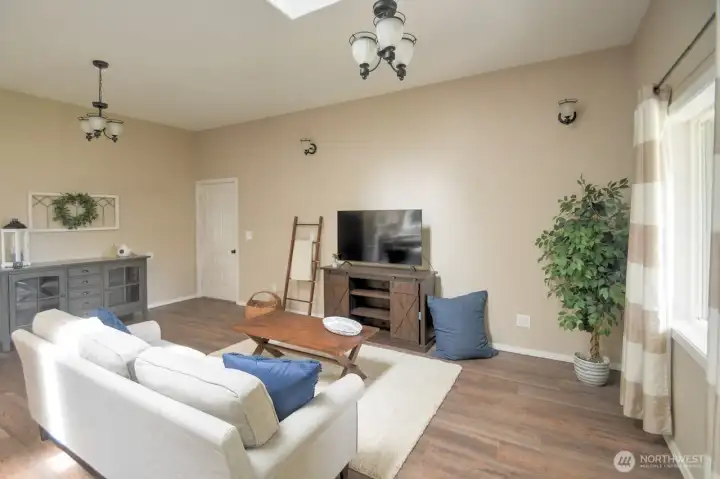 Great room adjoins the utility room en route to the garage. Great room adjoins the utility room en route to the garage.