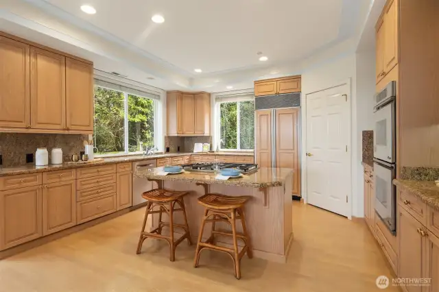 Cooks will delight in the generous kitchen with elite built-in appliances.