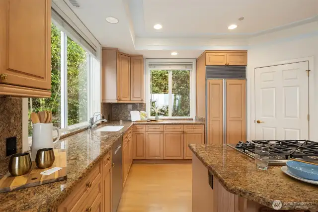 Built-in SubZero, ample counter/cabinet space, & walk-in pantry.