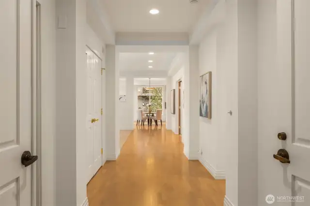Genuine hardwoods flow from the foyer to light-filled living spaces beyond.
