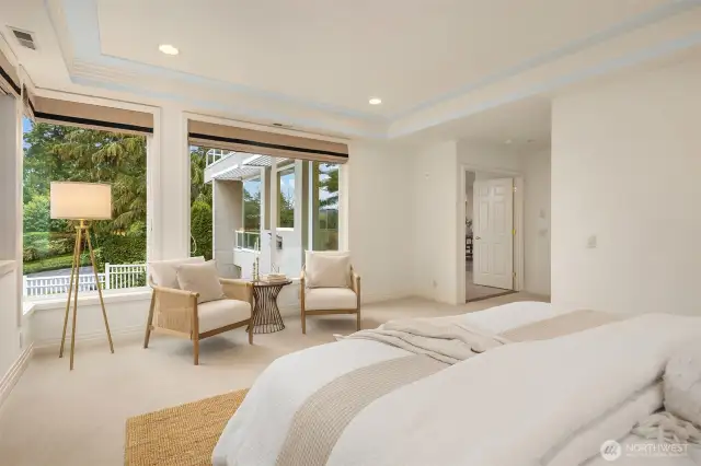 Tall, wrap-around windows afford light & lush green views.