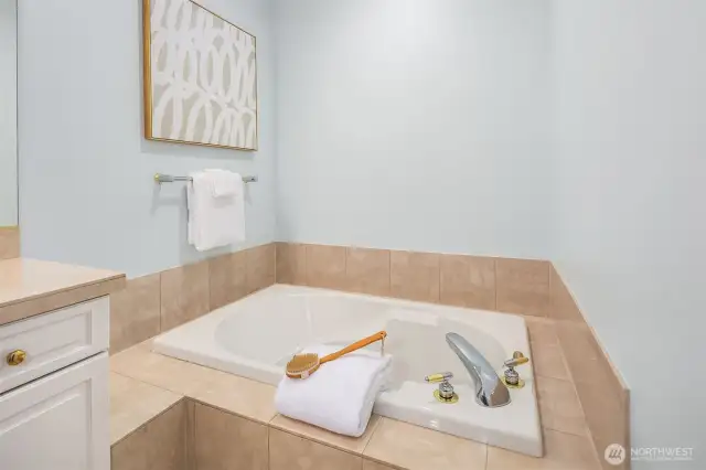 Soak your cares away in the separate, extra-deep tub.
