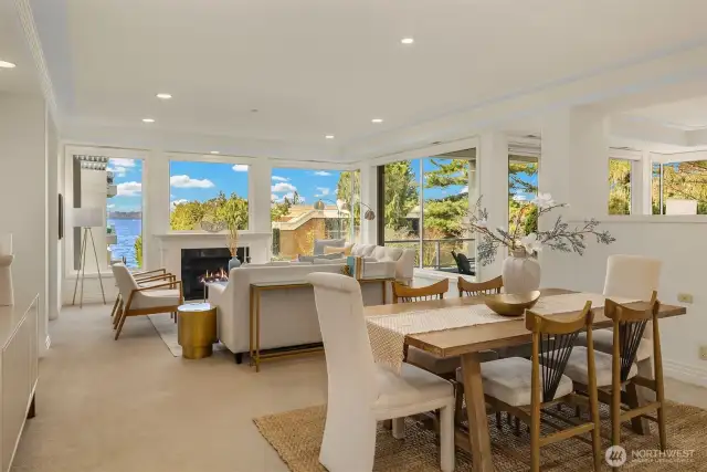 Sparkling lake views grace this open layout spanned by walls of windows.