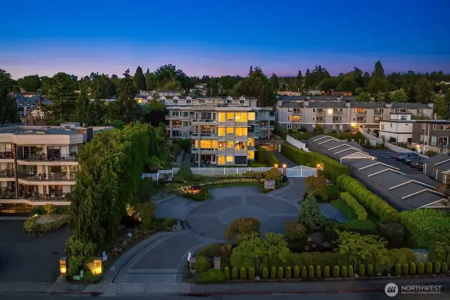 A manicured courtyard welcomes you home to this meticulously maintained building.