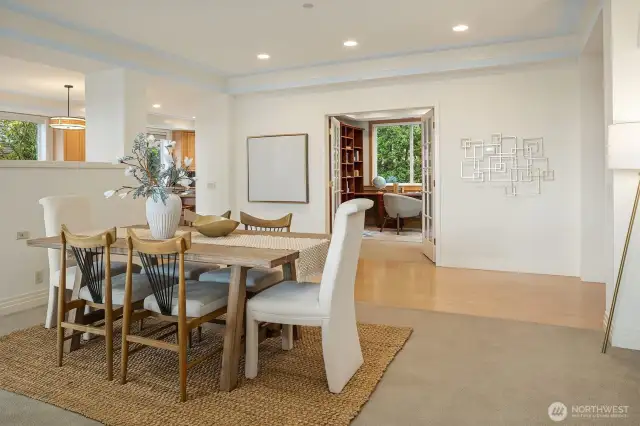 French doors open from the dining area to the den/office.