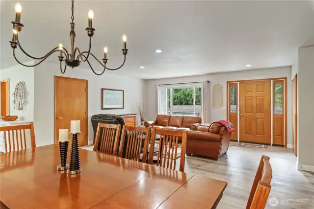 The dining, kitchen, and living areas blend seamlessly together.