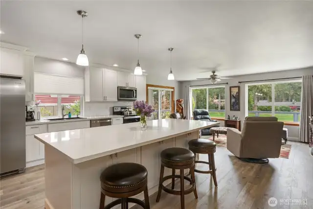 What a beautiful light and bright kitchen, with gorgeous views of the golf course. Doing your chores here will be a joy!