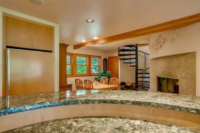Kitchen with breakfast nook, spiral stairs to primary suite