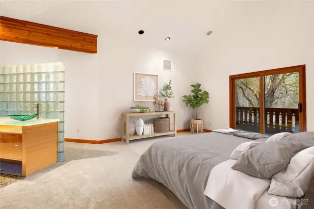 Primary Bedroom with slider to deck overlooking the river.