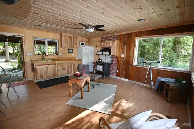 Warm & inviting 1 bdrm, half bath. Featuring cozy bar seating, a classic wood stove, an antique gas stove, and overhead LED lighting w/remote controlled fan.