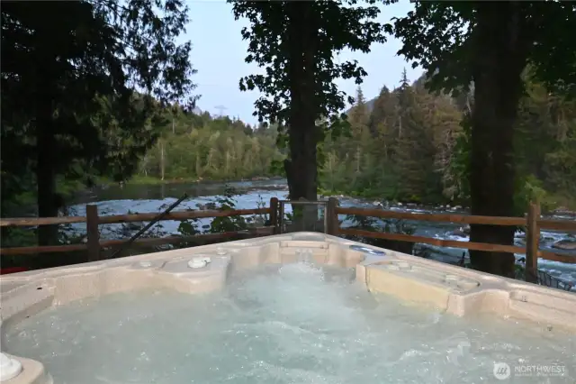 Relax in the hot tub as you overlook the peaceful river ~ natures remedy for stress.