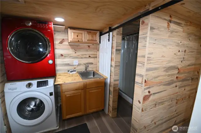 Full laundry setup and extra wash sink for added convenience.