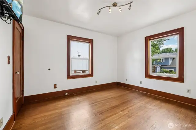 MAIN floor Bedroom 2 with window the rear yard