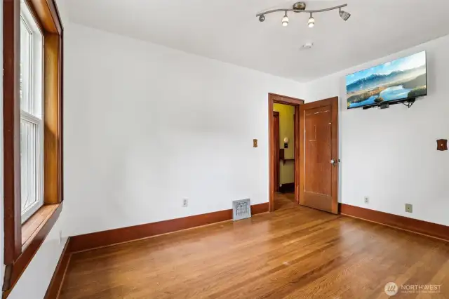 MAIN floor Bedroom 2 with window the rear yard. TV goes with seller.