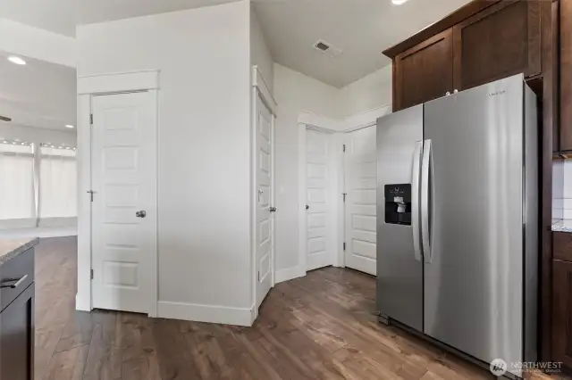 Kitchen showing 2 panrty closets & 1/2 bath off kitchen