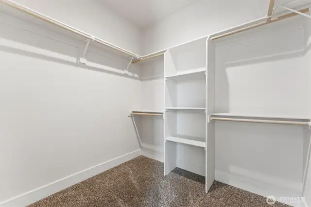 Primary bedroom walk-in closet