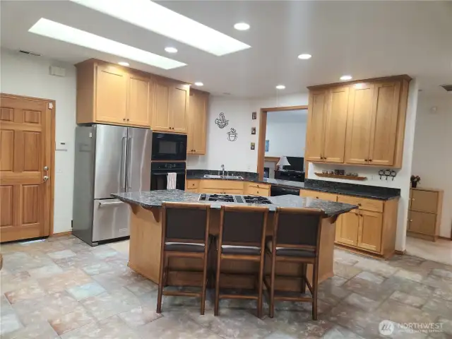 Beautiful chef's kitchen looks into the great room through the large pass-through window.