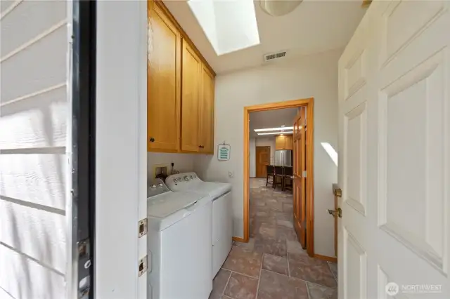 From the back door, enter into the large laundry room.