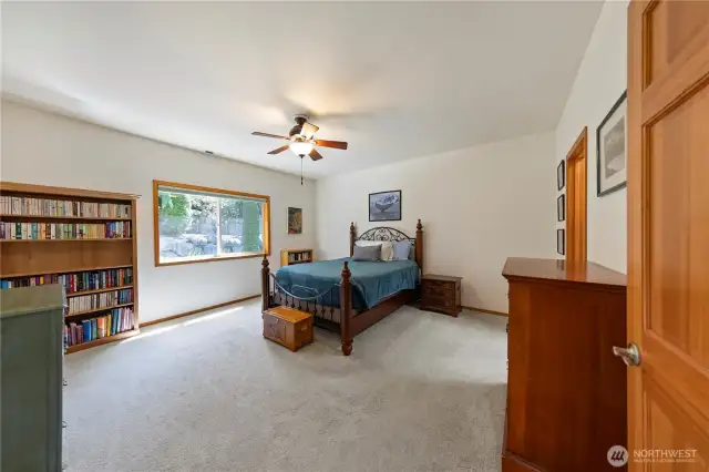 Enter the primary bedroom to the right of the kitchen.  Plenty of room for a king size bed and large furniture.