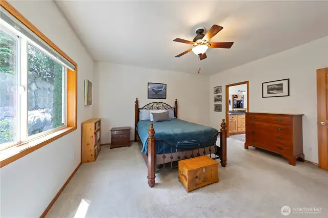 Primary bedroom with ensuite and large walk-in closet.