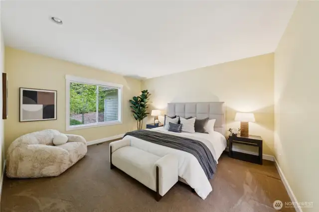 Oversized primary bedroom with a spa-like en-suite, offering a comfortable retreat for rest and relaxation.