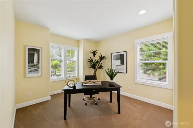 One of two guest bedrooms is located near the entrance and can easily function as a home office or den.