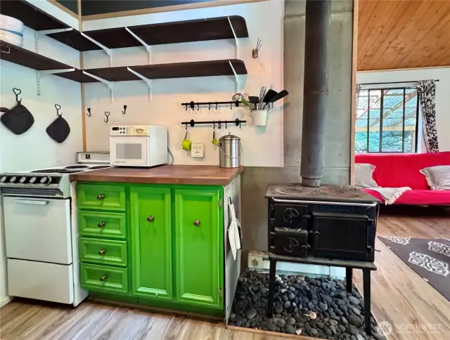 Open shelving in kitchen and butcher block counter top