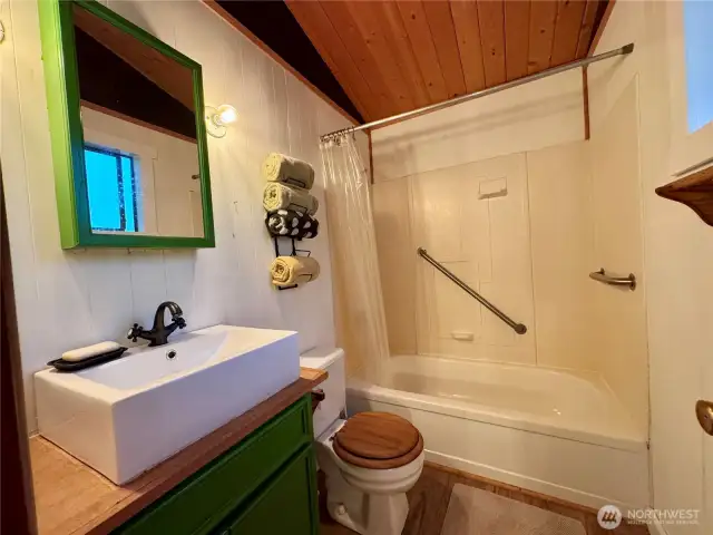 Full bathroom with tub and shower