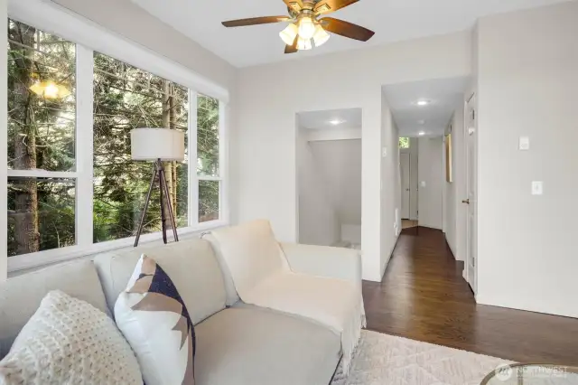 Living room leading to downstairs