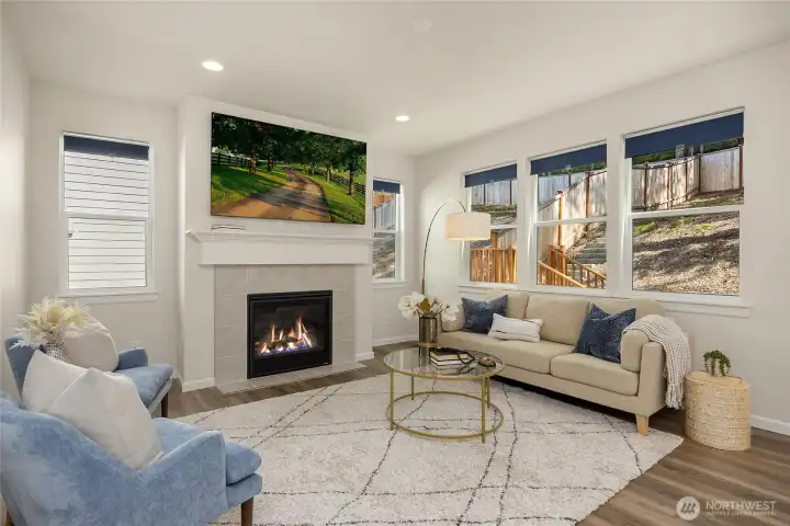 The living room is anchored by the natural gas fireplace with ceramic tile surround. Connections for your entertainment system are located above the elegant mantle.