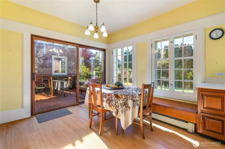 In addition to the large formal dining room, the spacious kitchen provides a comfortable place for casual meals, with storage beneath the charming window seats. Sunlight fills every corner of the home, highlighting the warmth and character brought by the abundance of windows throughout.