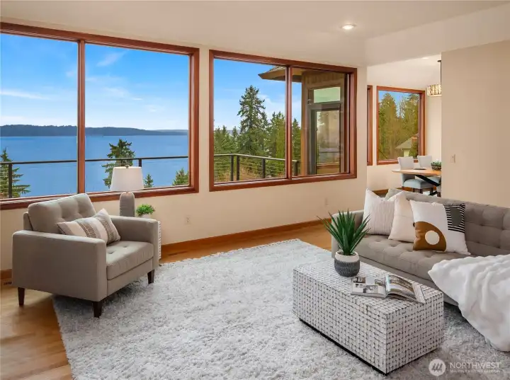 This eve- changing view will enhance your life.  Relax on the expansive upper level deck and enjoy the maritime traffic or stunning sunsets over the Olympic Mountain range.