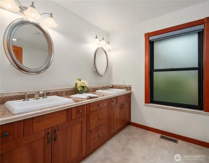 Additional main floor large bathroom features double sinks and custom soaking tub!